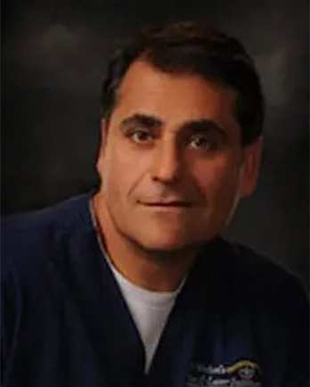 Professional headshot of Dr. John Michaelos, ophthalmologist and CEO of St. Michael’s Eye & Laser Institute
