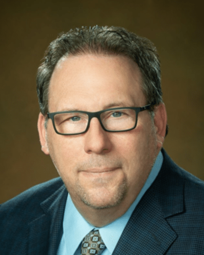 Professional headshot of Dr. Oren Plous, retina specialist at St. Michael’s Eye & Laser Institute.